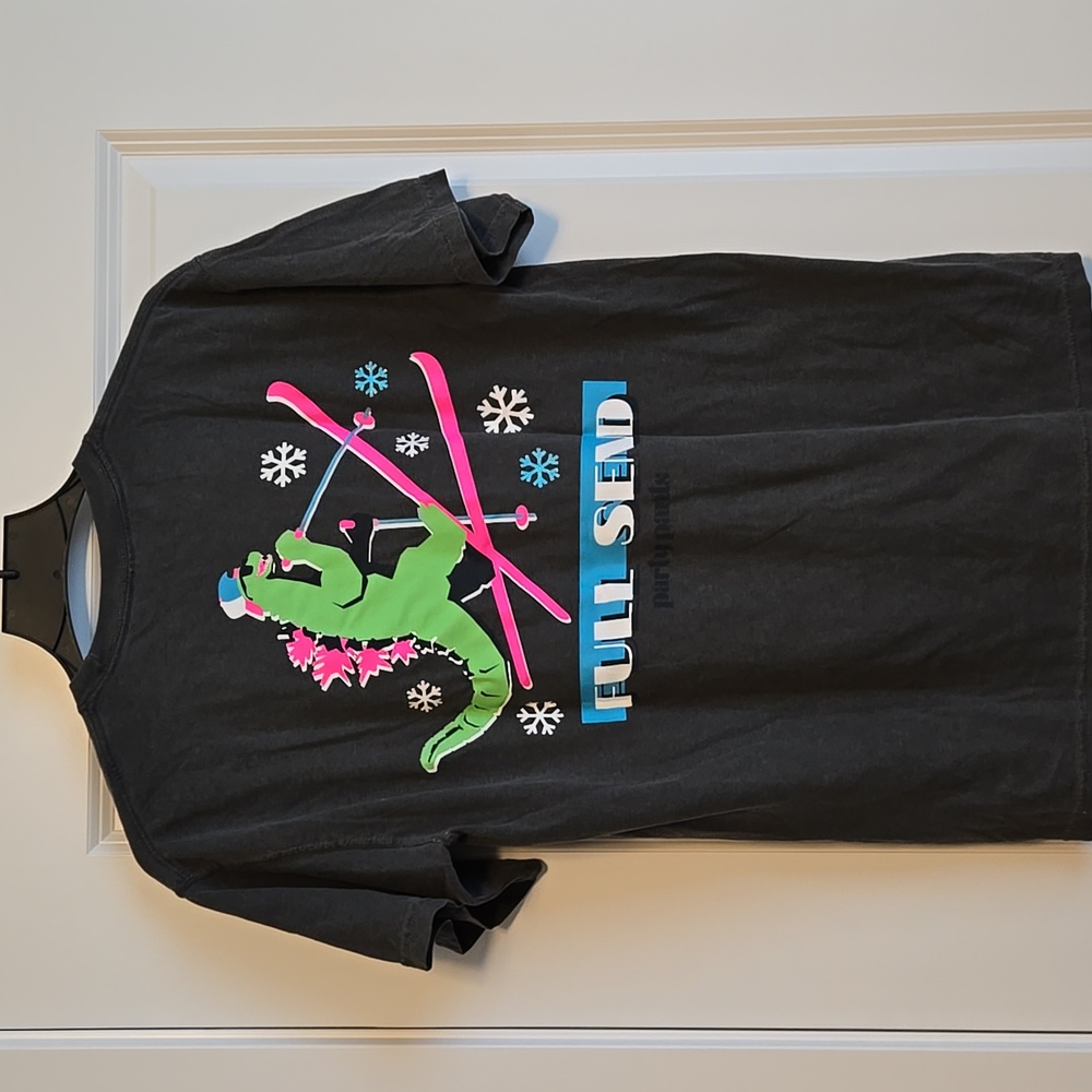 Party Pants Graphic Tee with Dinosaur Skiing Design